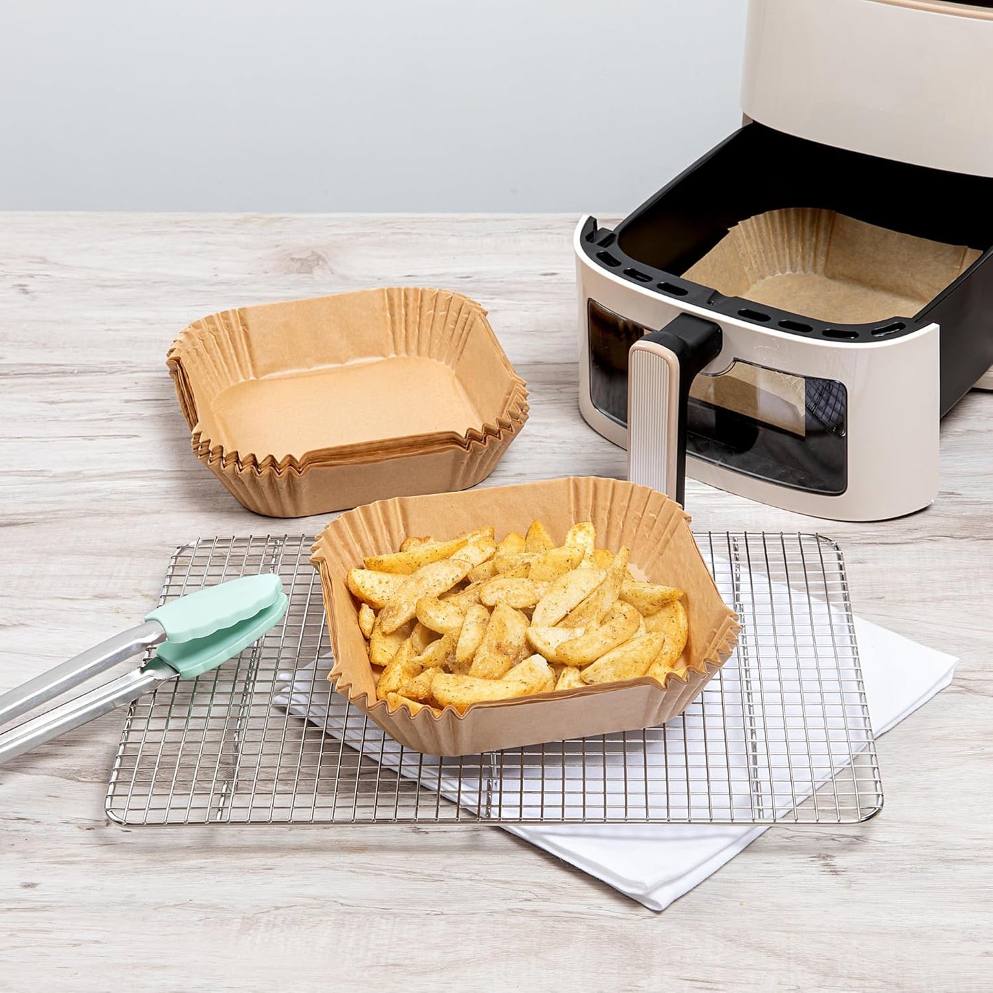 Restaurantware-Pastry Tek 6.3 x 6.3 x 1.8 Inch Air Fryer Liners, 100 Square Air Fryer Baskets - No-Stick Silicone Coating, Unbleached, Food-Grade Paper Liners, For Steamer, Microwave, Oven, Fry Pan